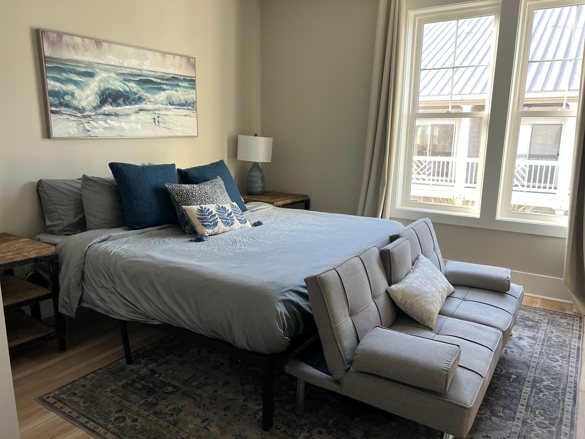 Before: Bedroom with gray bedding