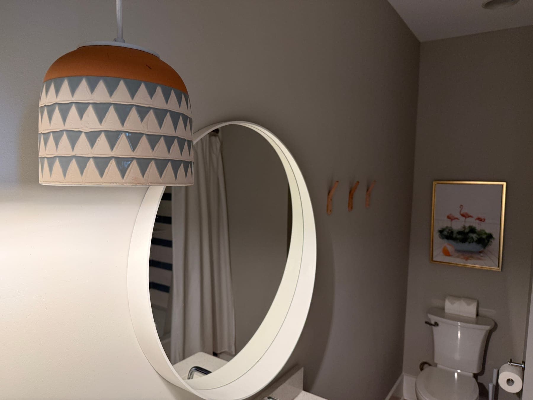 Original rental bathroom detail photo with dim light before editing